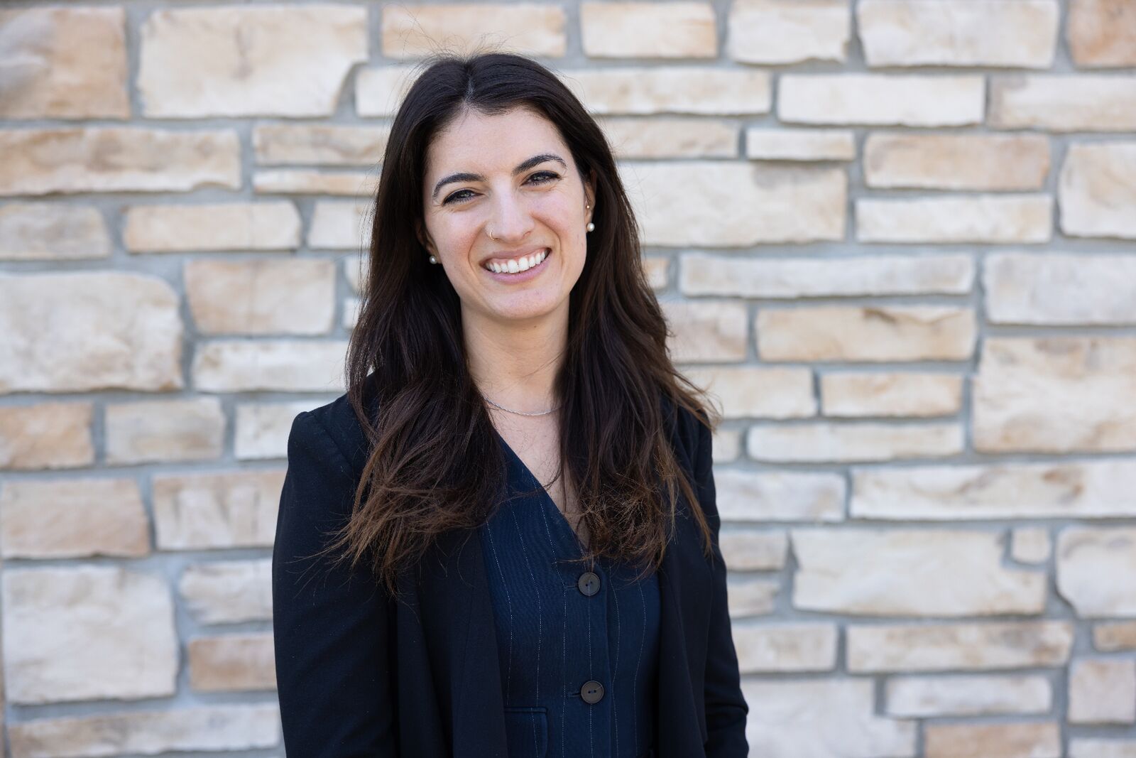 Ana Zedginidze, founder of Therapy Coverage, smiling in a professional setting.