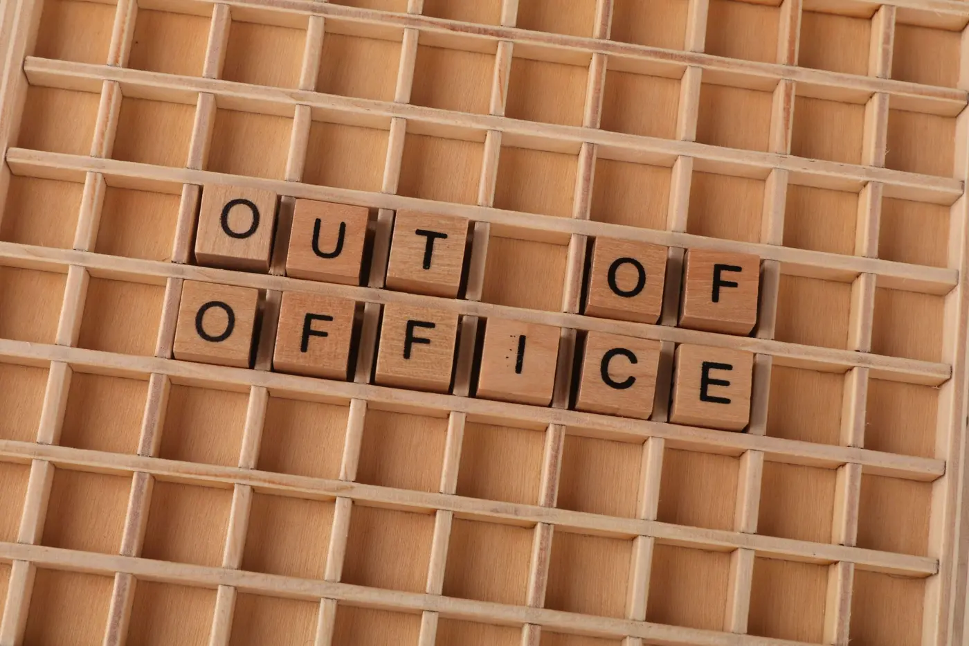 Wooden letter tiles spelling out of office